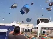 Dust Devil Makes Tourists' Stuff Fly Around