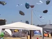 Dust Devil Makes Tourists' Stuff Fly Around