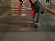 Guy Riding Skateboard While Performing Handstand