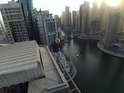 Man Performs Some High-Rise Stunts