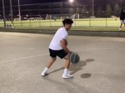 Guy Simultaneously Dribbles Two Basketball
