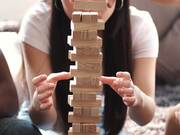 Friends Playing Jenga